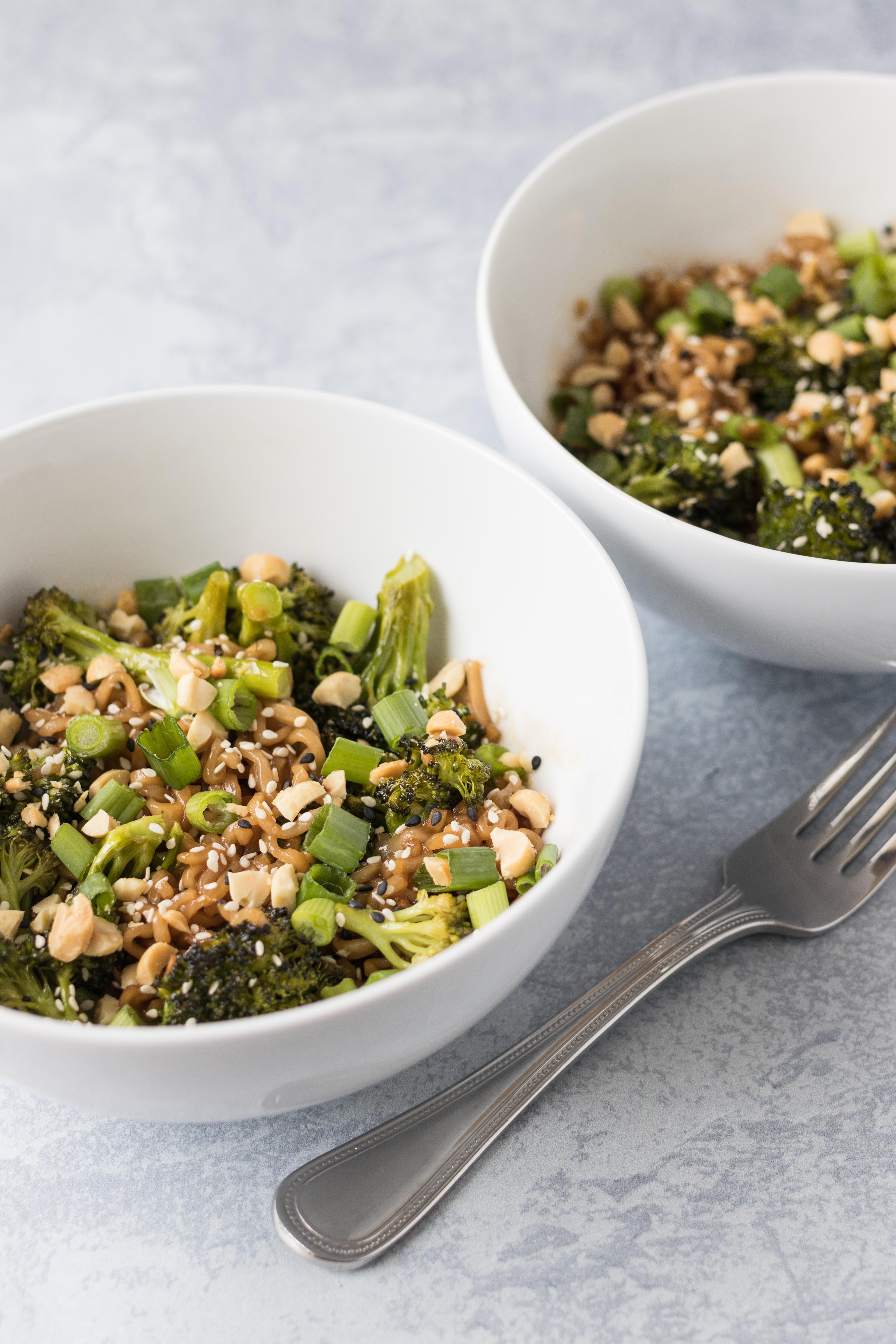 Sesame ramen noodles and roasted broccoli, topped with toasted sesame oil, peanuts, and green onion. Quick lunch dish packed with flavor! #sesameRamen #peanutnoodles #quicklunchidea | https://www.roseclearfield.com