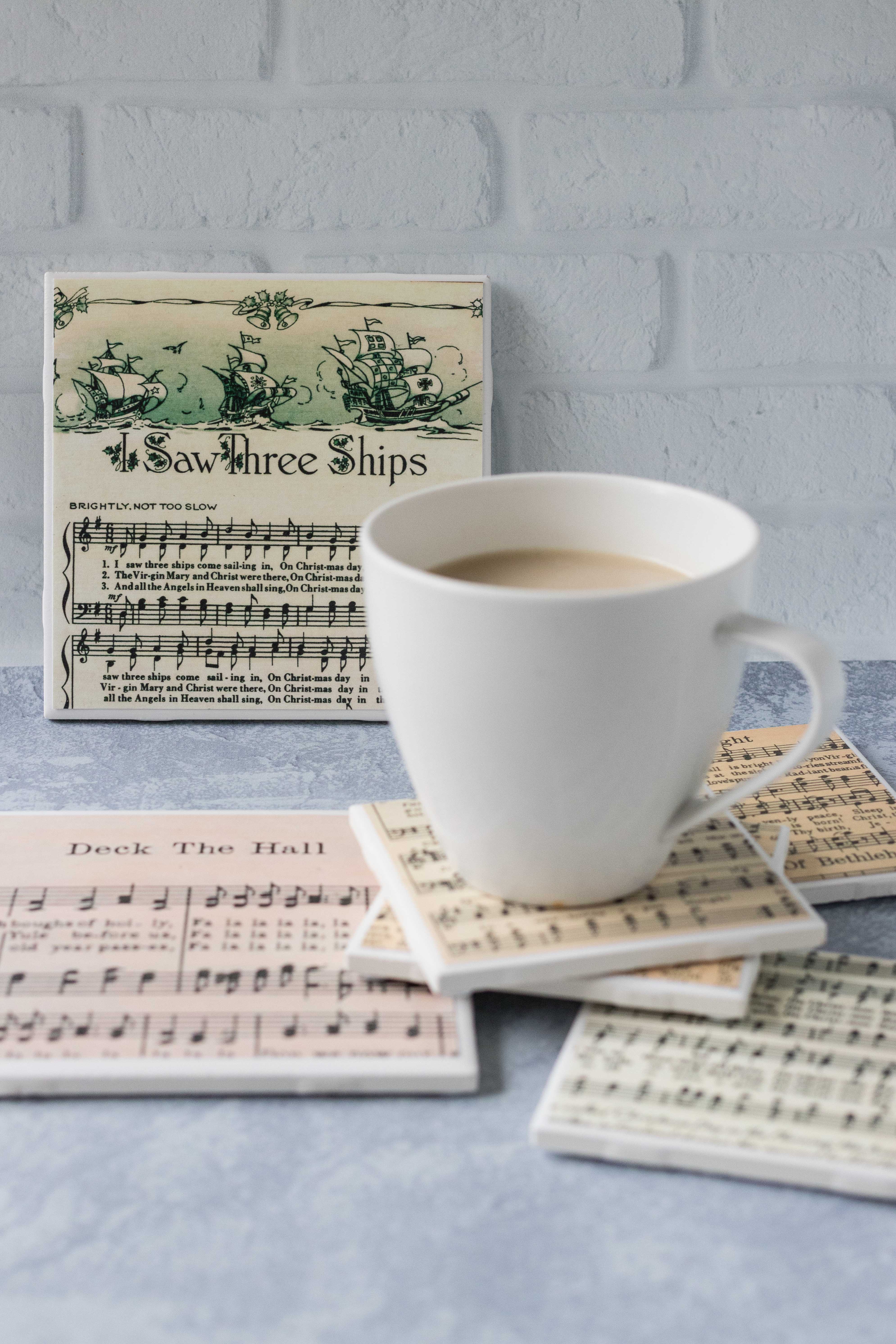 DIY tile coasters with vintage Christmas sheet music. Awesome holiday gift idea! #DIYtilecoasters #sheetmusiccraft #DIYChristmas | https://www.roseclearfield.com