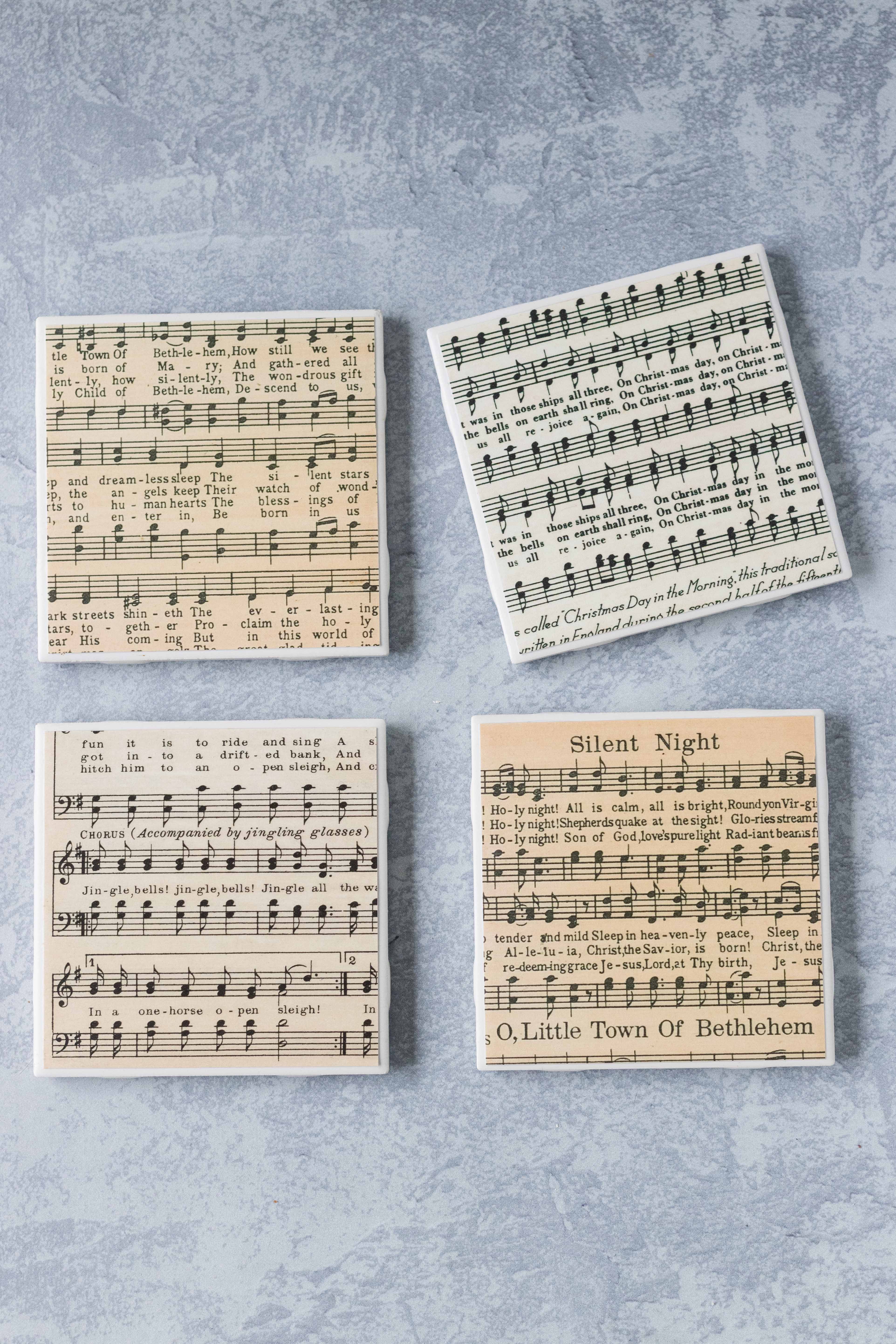 DIY tile coasters with vintage Christmas sheet music. Awesome holiday gift idea! #DIYtilecoasters #sheetmusiccraft #DIYChristmas | https://www.roseclearfield.com
