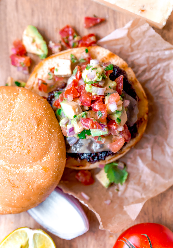 Southwest burgers with pepper Jack cheese and avocado salsa. So much flavor! via A Beautiful Plate | https://www.roseclearfield.com