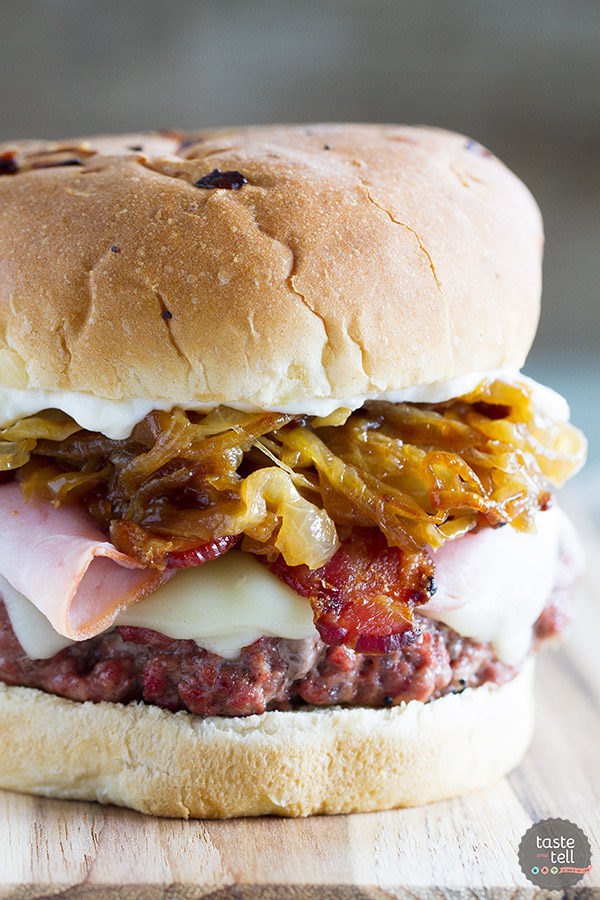 Triple pork burgers, made with beef and pork, topped with ham, bacon, and caramelized onions. So much flavor! via Taste and Tell #porkburgers #baconburgers #grillingrecipes | https://www.roseclearfield.com