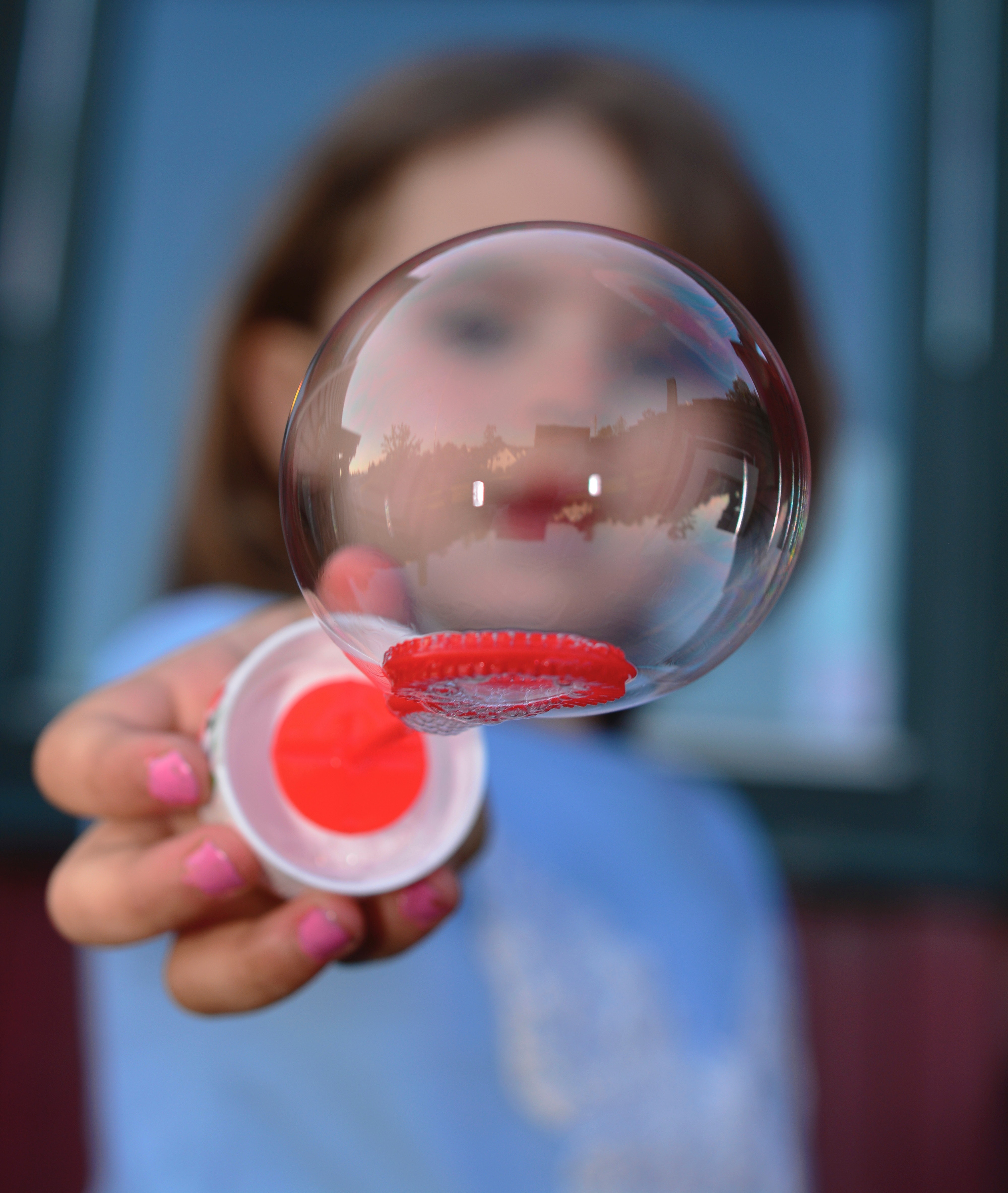 Blowing a bubble close up. #bubbles #summer #summerfun | https://www.roseclearfield.com