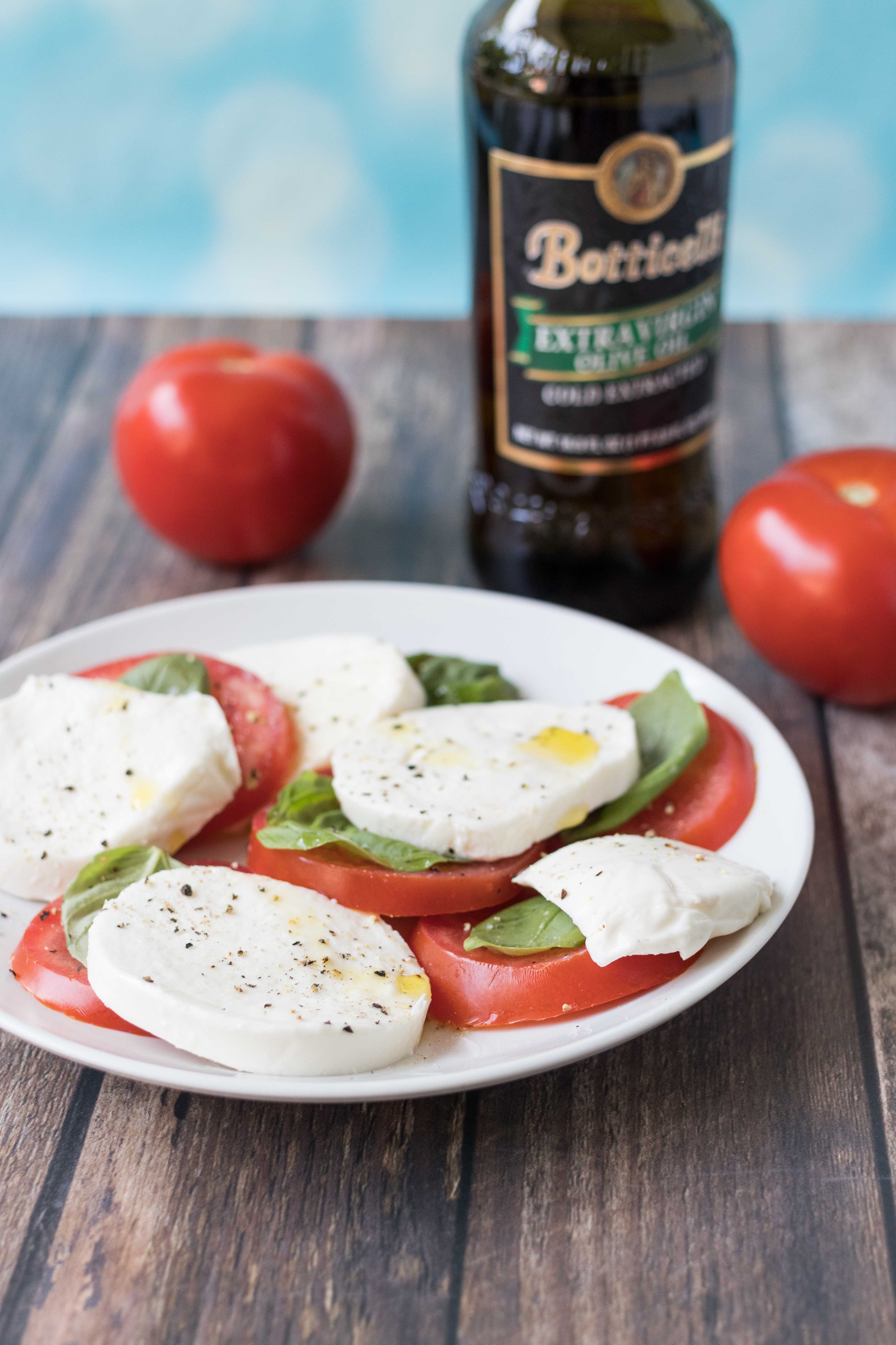 Caprese salad. Simple, nutritious summer recipe, perfect for seasonal tomatoes and basil. #caprese #capresesalad #capreserecipes | https://www.roseclearfield.com