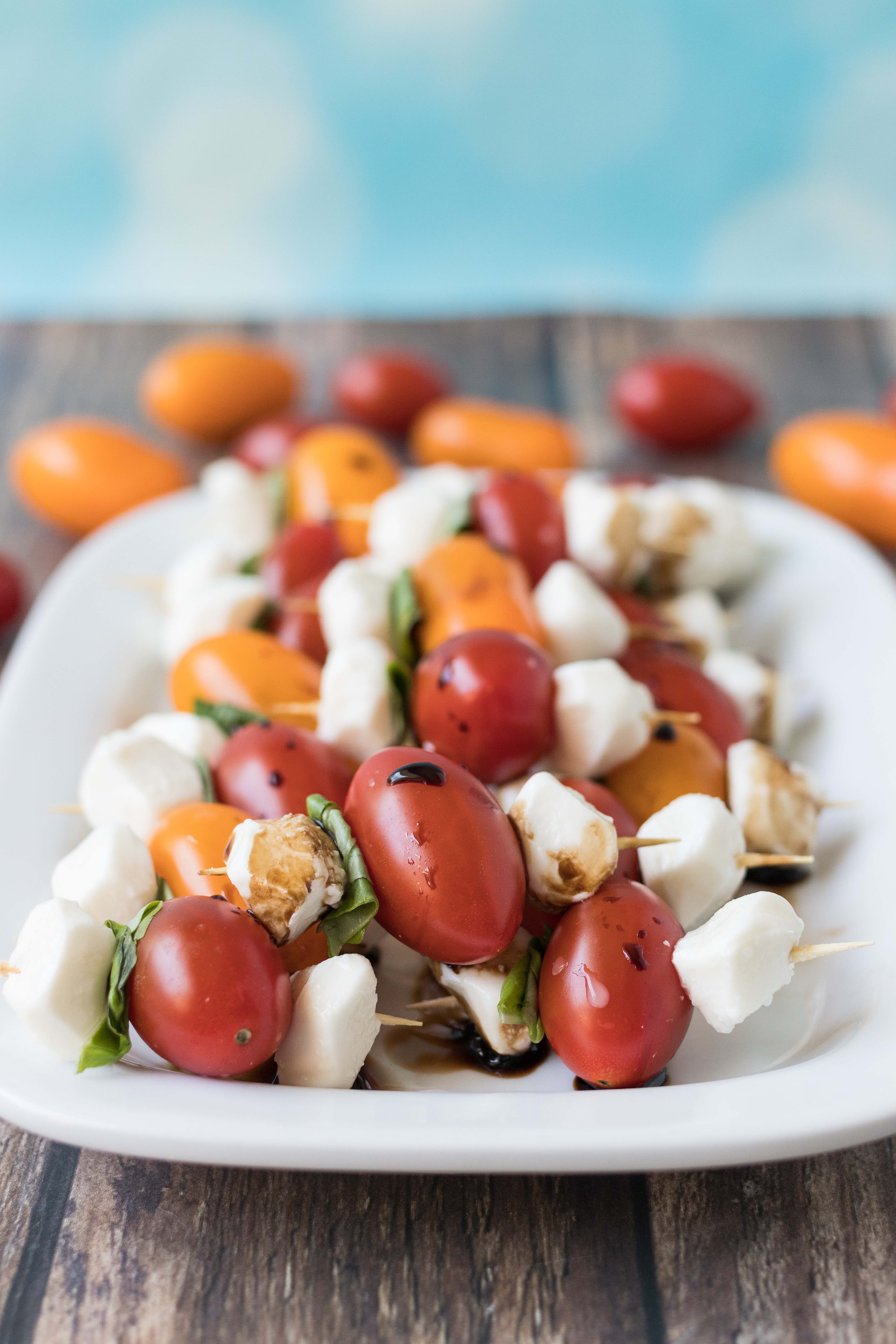 Caprese skewers. Easy, flavor-packed appetizer for summer dinners and social gatherings! #caprese #capreseskewers #summerappetizer #appetizeridea | https://www.roseclearfield.com