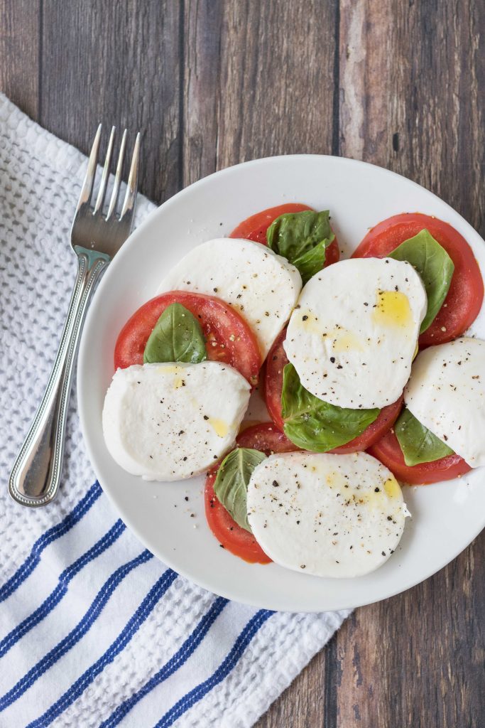 Caprese salad is an easy, flavorful summer recipe to use up fresh tomatoes and basil. #capresesalad #capreserecipes #summerrecipes