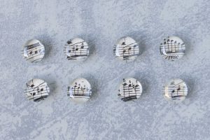 DIY decorative stone sheet music glass magnets. Easy, inexpensive home decor craft project! #DIY #sheetmusic #handmademagnets | https://www.roseclearfield.com