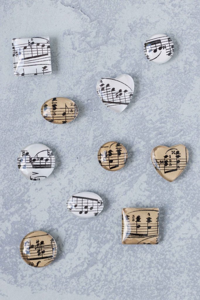 DIY sheet music glass magnets in assorted shapes. Easy home decor craft project! #DIY #homedecor #sheetmusic #glassmagnets