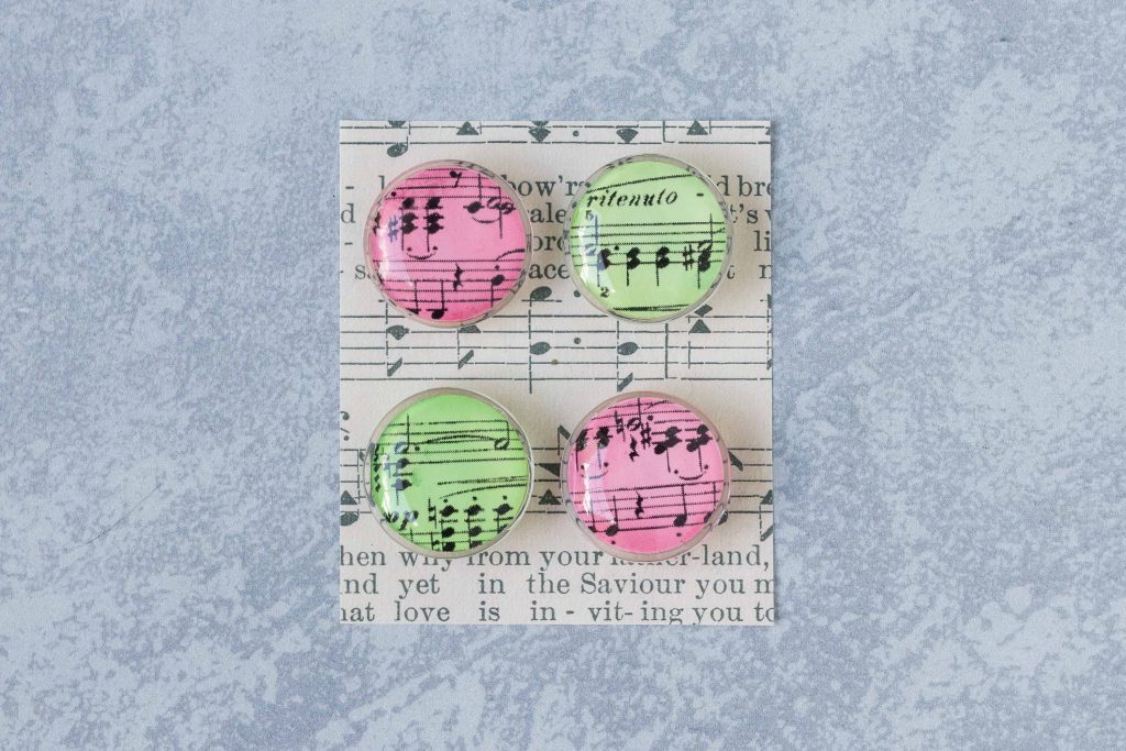 DIY Christmas sheet music glass magnets. An easy, festive craft project to give as gifts or sell on Etsy or at craft fairs. #DIY #sheetmusic #Christmascraft