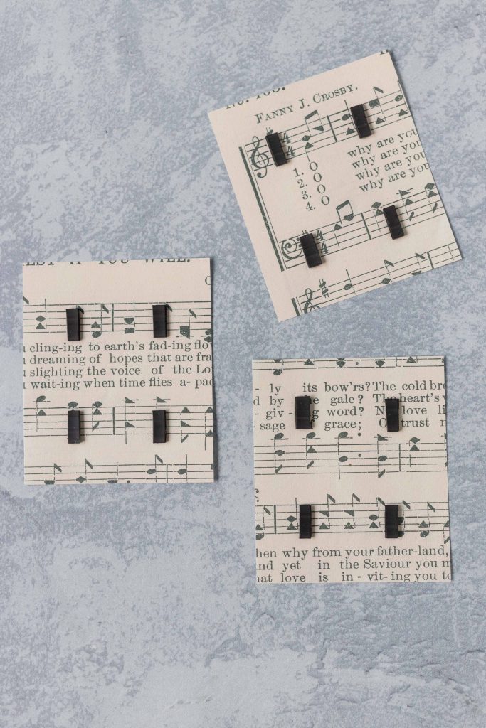 Cardstock-printed sheet music with flexible magnetic strip for packaging homemade glass magnets. #DIY #sheetmusic #homemademagnets #glassmagnets