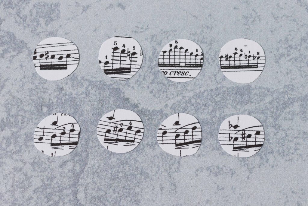 Sheet music circles, ready to be made into glass magnets. #DIY #glassmagnets #sheetmusiccraft