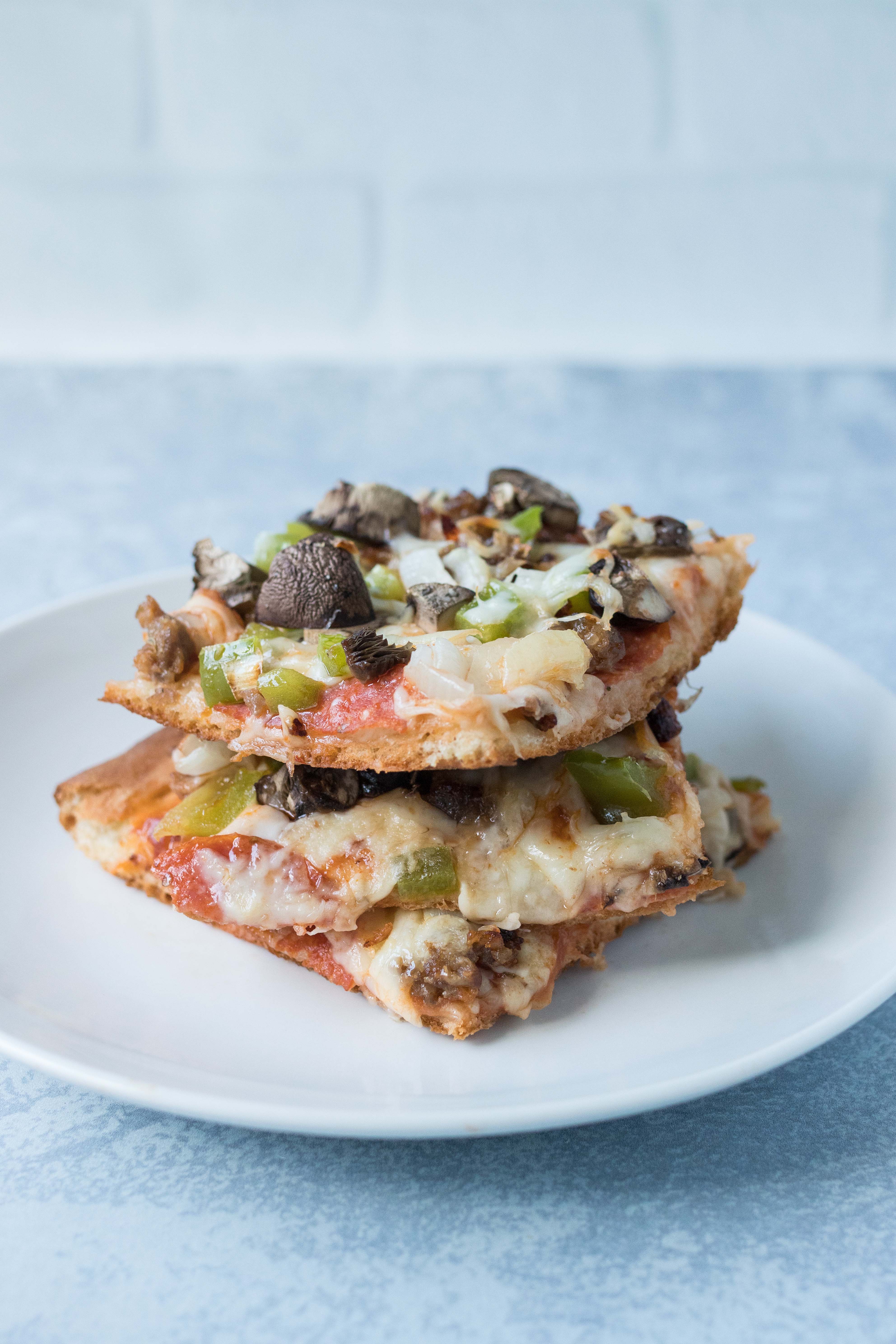 The best homemade supreme pizza. An easy, family-friendly recipe for busy weeknights! #homemadepizza #supremepizza #weeknightdinner | https://www.roseclearfield.com