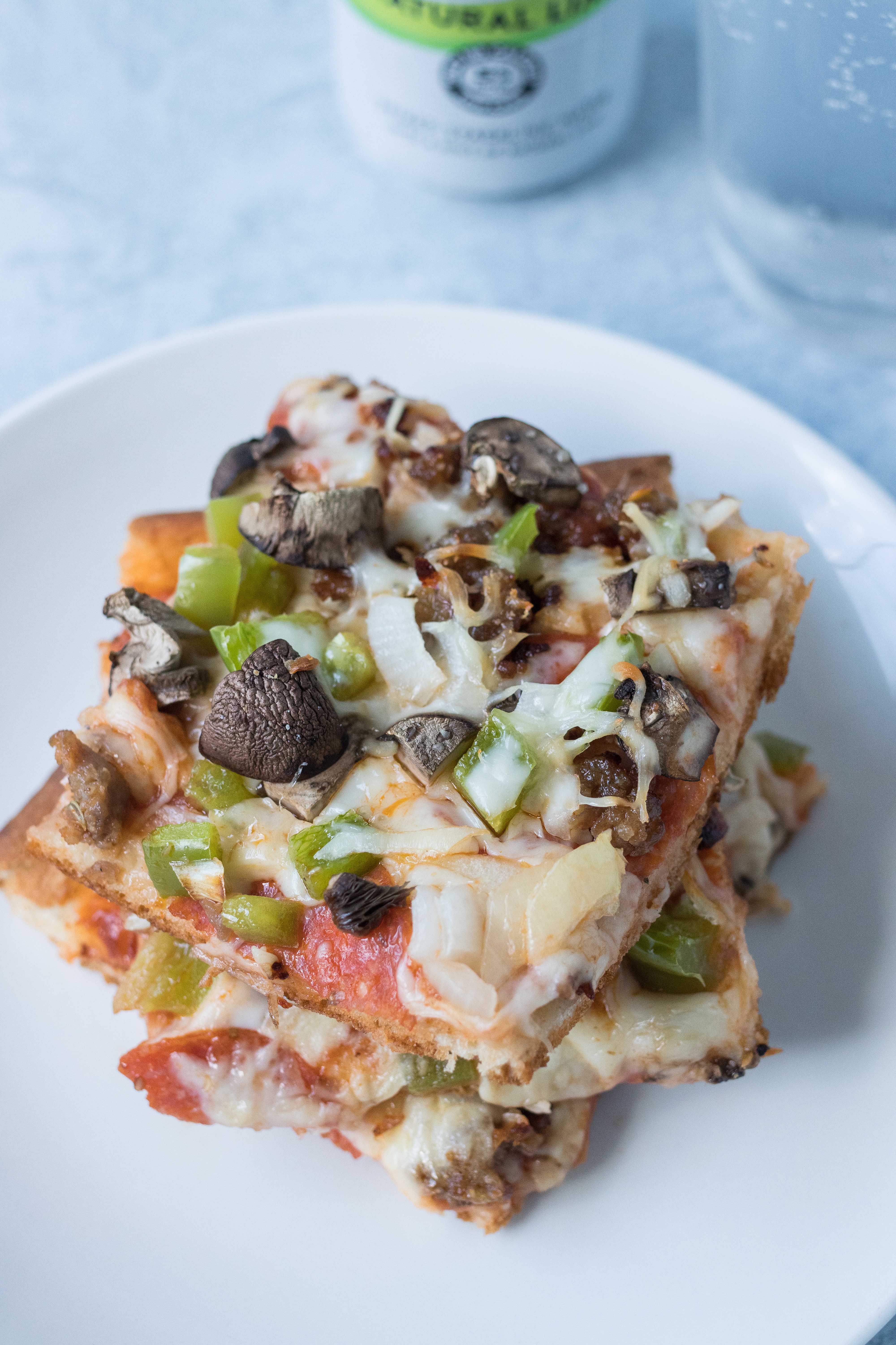 The best homemade supreme pizza. Perfect for family movie night! #homemadepizza #supremepizza #familydinner | https://www.roseclearfield.com