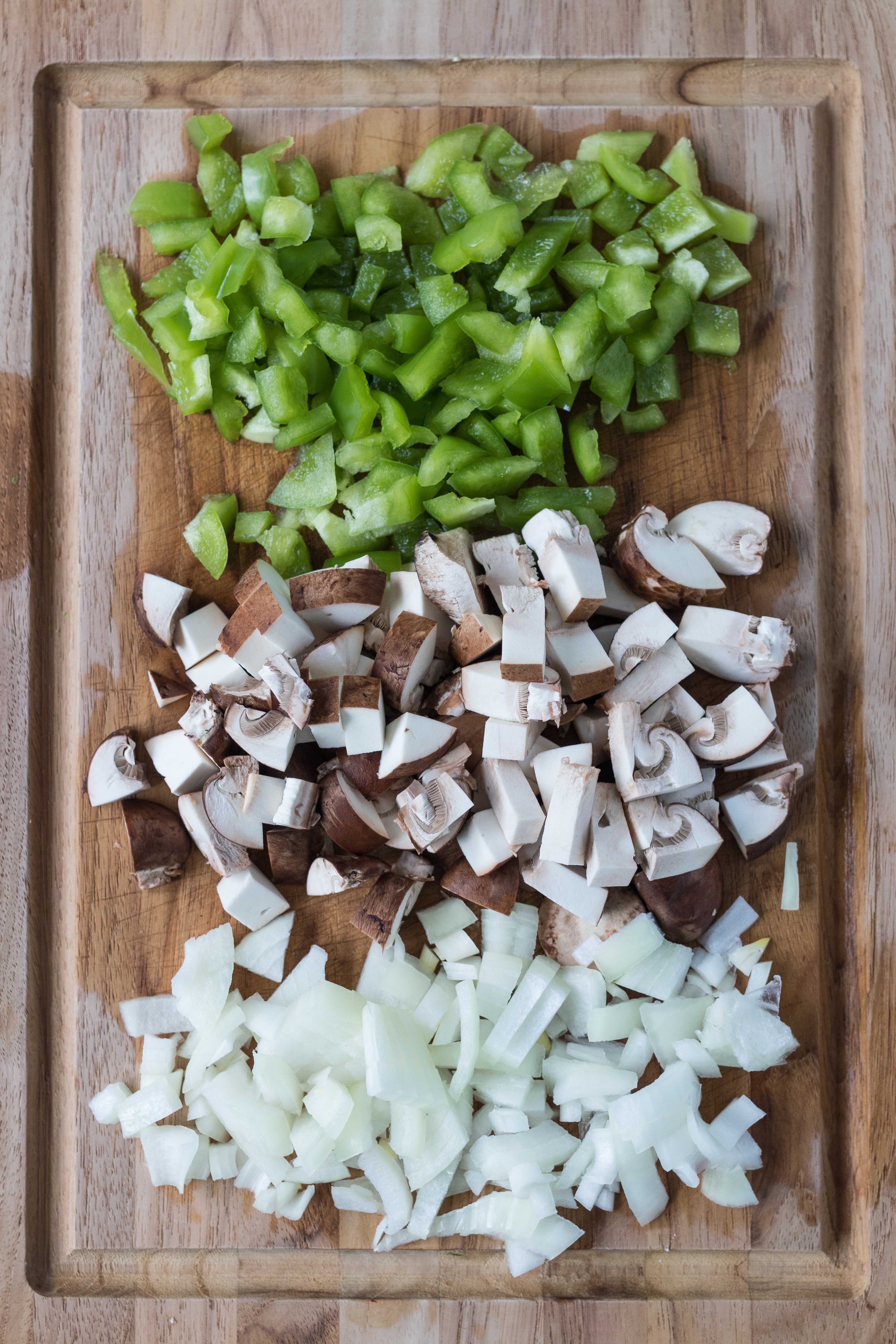 Diced green pepper, mushroom, and onion for homemade supreme pizza. #dicedveggies #homemadepizza #supremepizza | https://www.roseclearfield.com