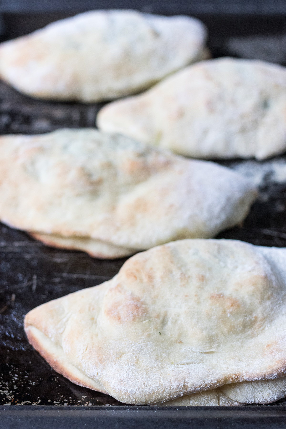 Cheesy Spinach Sausage Calzones