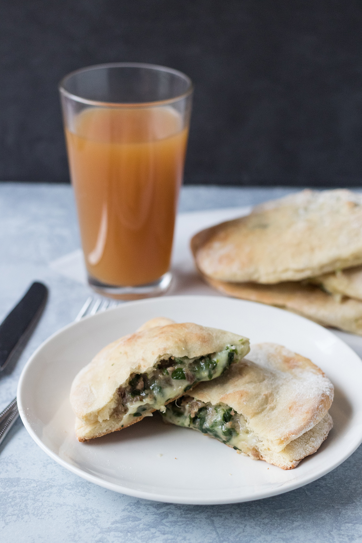 Cheesy Spinach Sausage Calzones