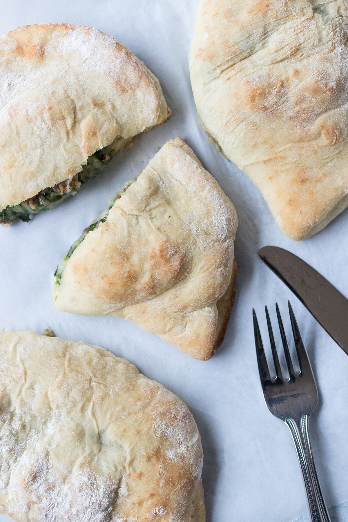 Cheesy Spinach Sausage Calzones