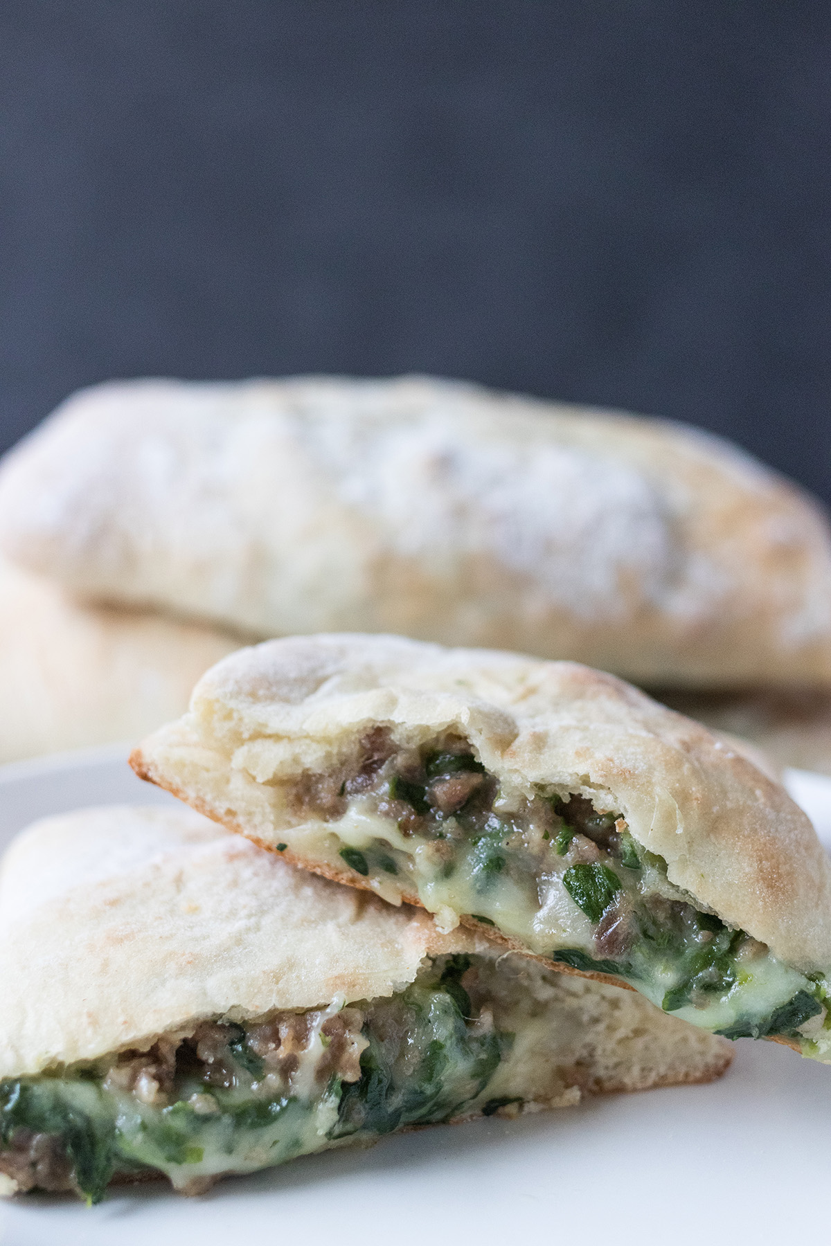 Cheesy Spinach Sausage Calzones