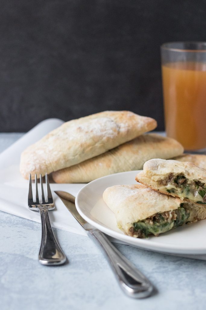 Cheesy Spinach Sausage Calzones