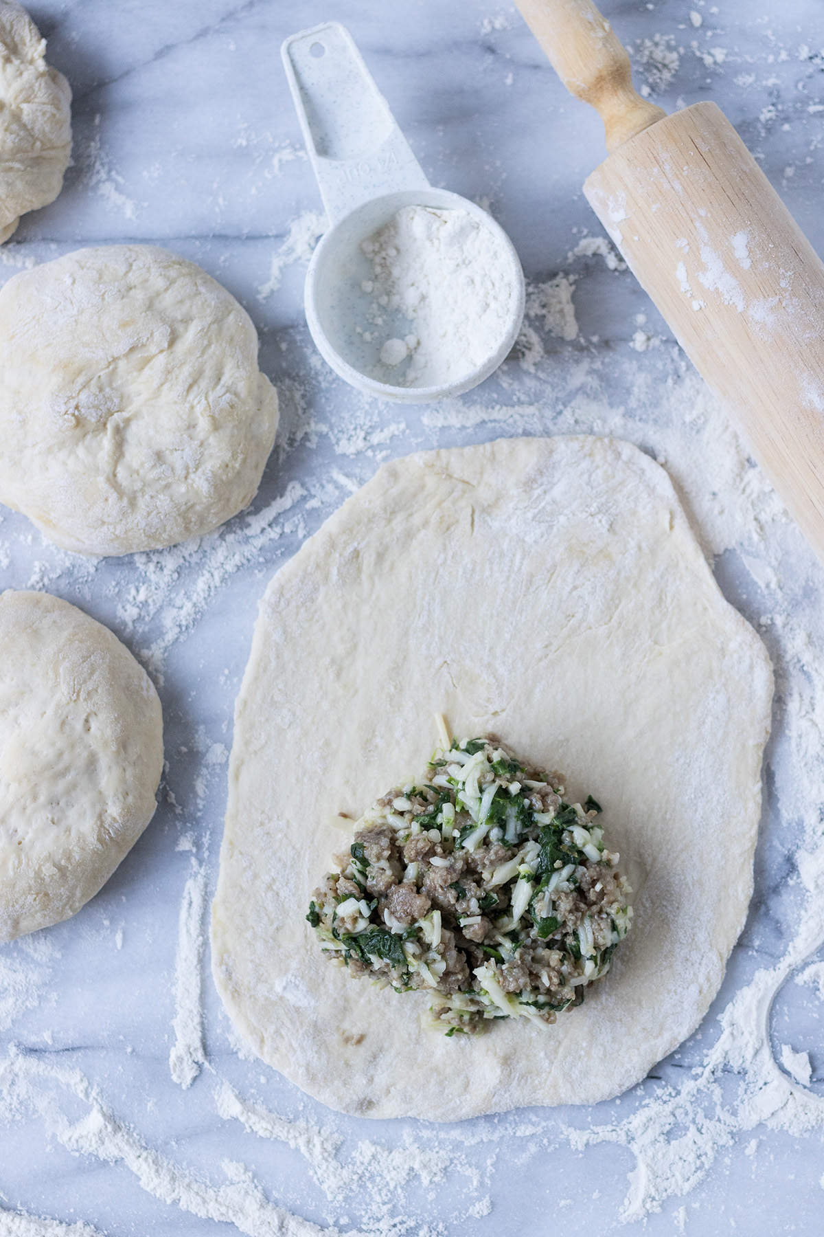 Cheesy Spinach Sausage Calzones