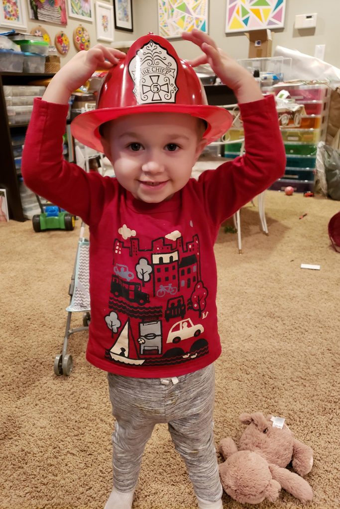 Toddler with Fireman Hat