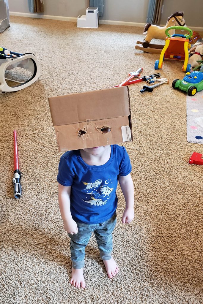 Toddler with Box on Head