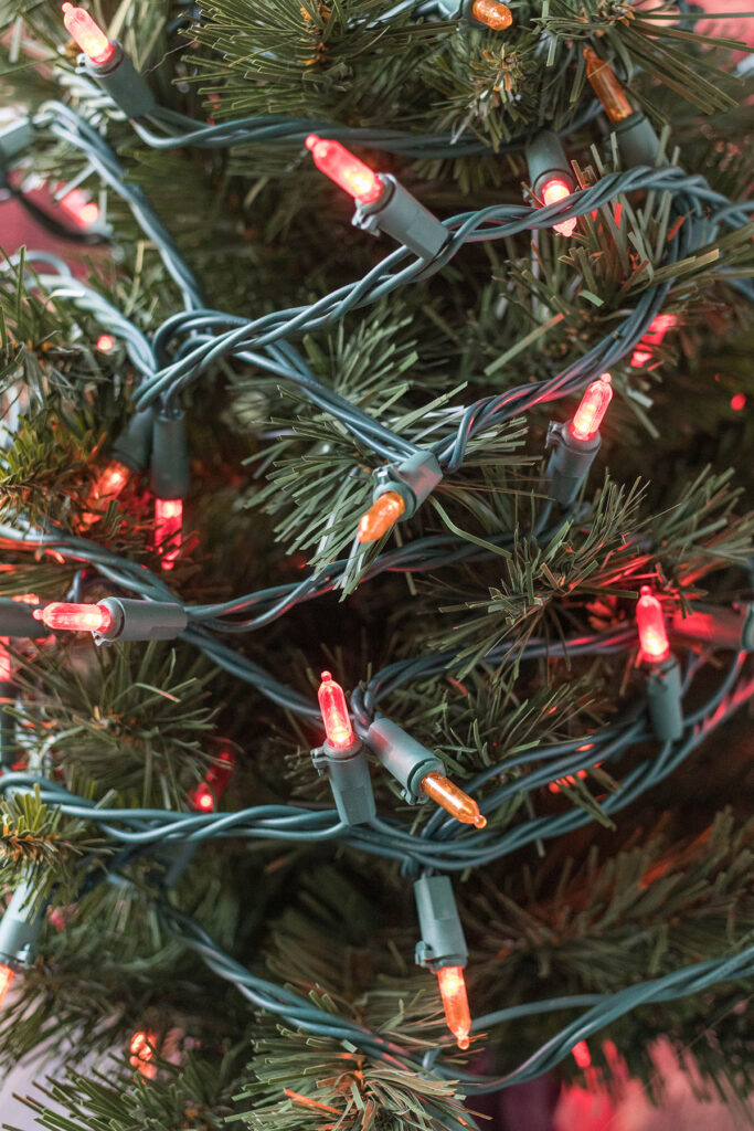 Mini Faux Fir Tree with Red and Orange Lights