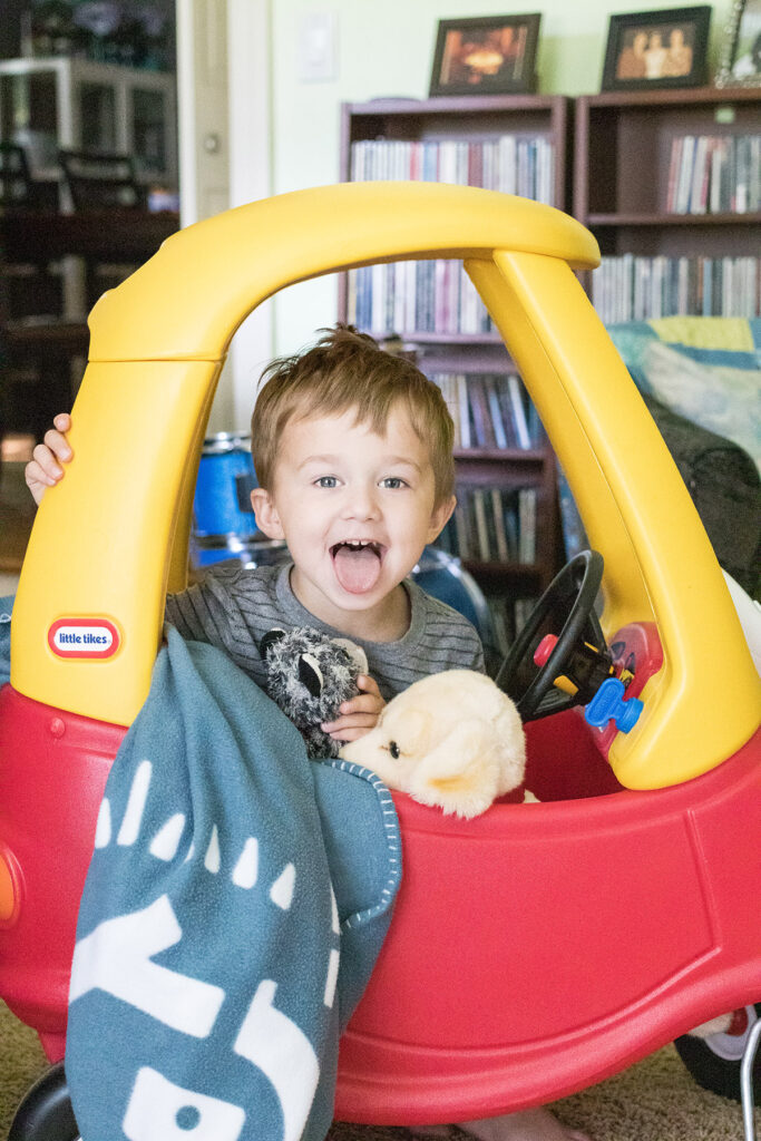 Tommy in the Cozy Coupe