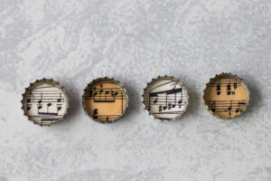 Bottle Cap Sheet Music Magnets