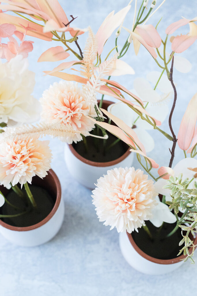 Overhead View of Faux Floral Bouquets in Ceramic Vases